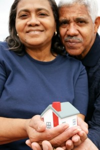 ElderlyCoupleHoldingHome Save energy in your home